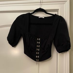 Puff sleeve black crop top with gold detail!